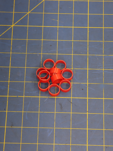 Part1117730 on a blue measuring grid mat 