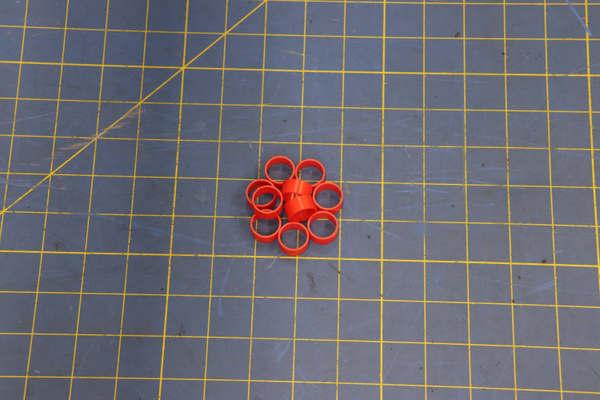 Part1117730 on a blue measuring grid mat 